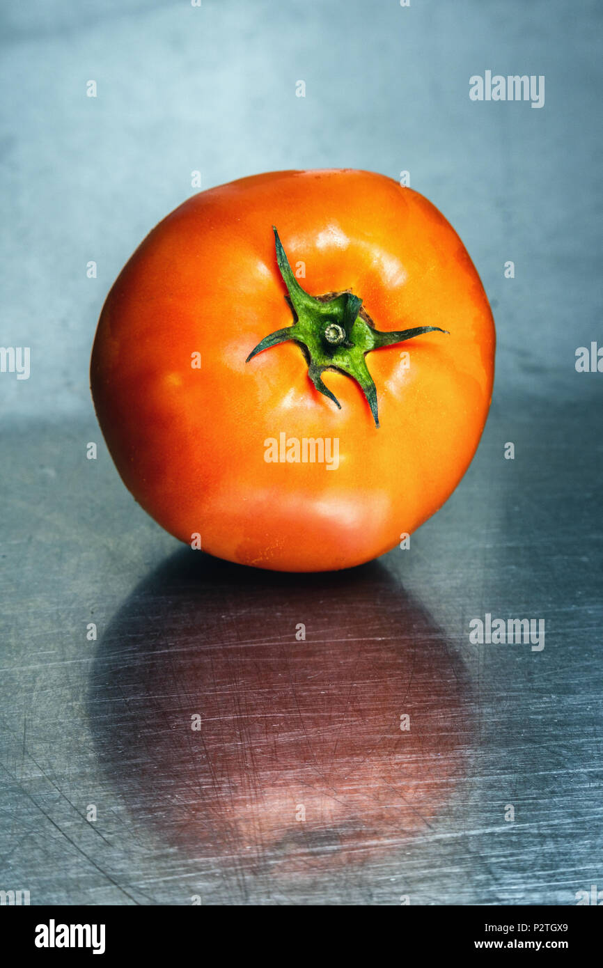tomato on a stainless steel background Stock Photo