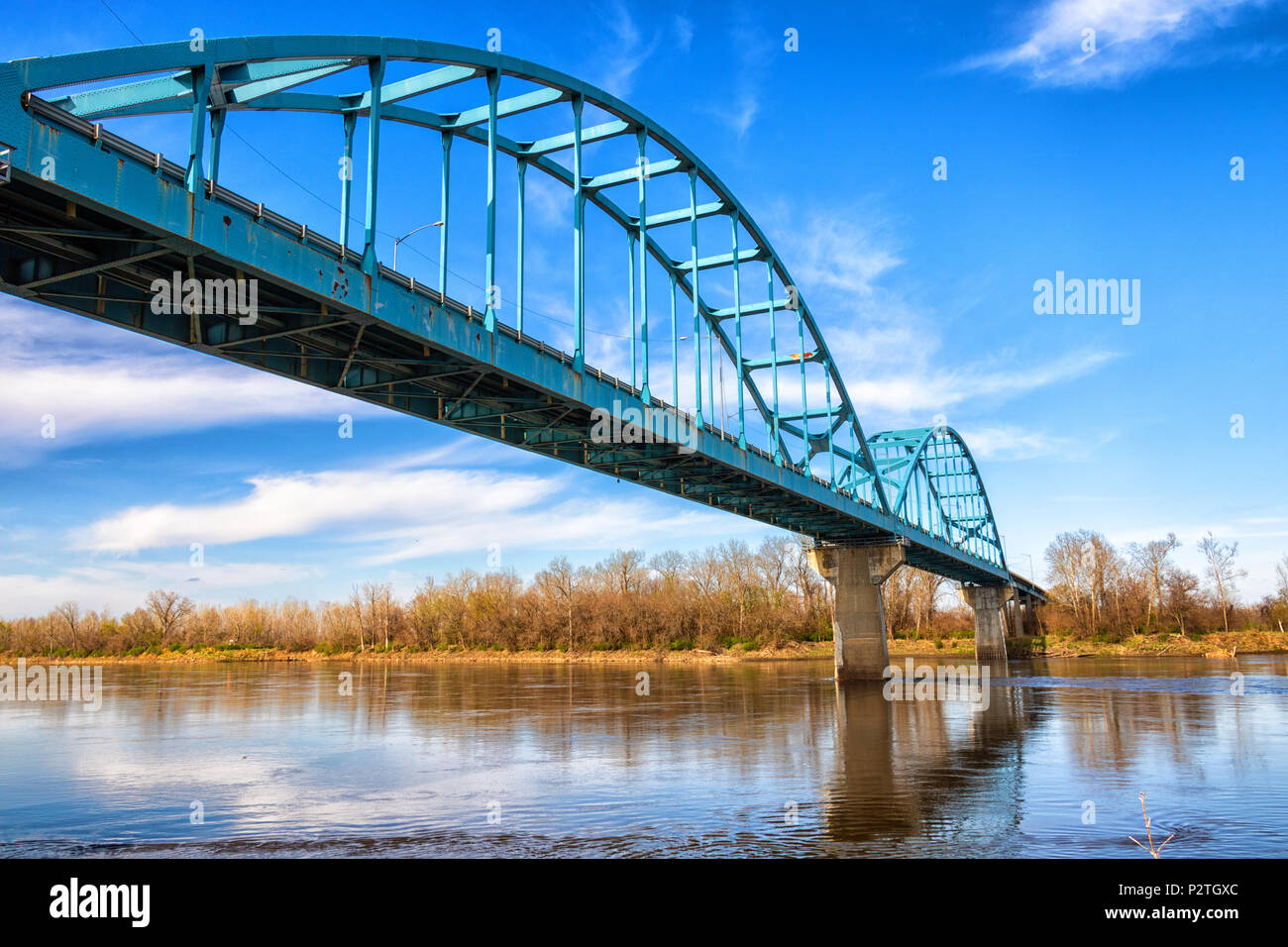 Missouri river bridge at Leavenworth Kansas, there is nice reflection in water and vivid colors Stock Photo
