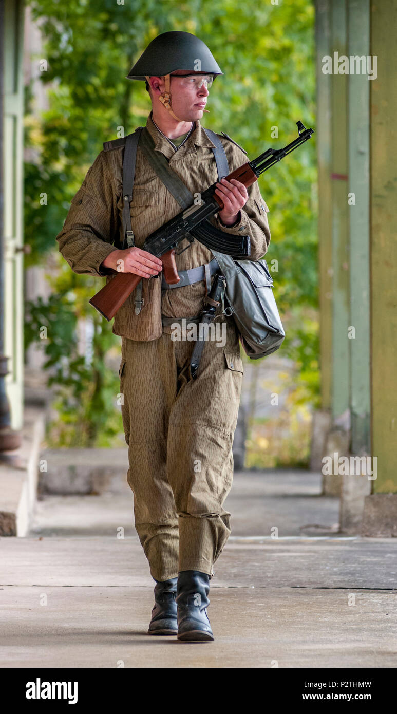 An airsoft player wearing East German Junior Non-Commissioned Officers  uniform with an AK-47, The Kalashnikov (Posed ny model Stock Photo - Alamy
