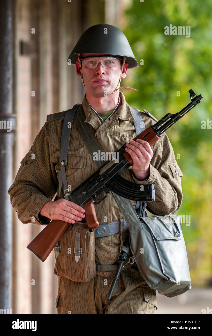 An airsoft player wearing East German 1975, Junior Non-Commissioned  Officers uniform with an AK-47, The Kalashnikov (Posed ny model Stock Photo  - Alamy