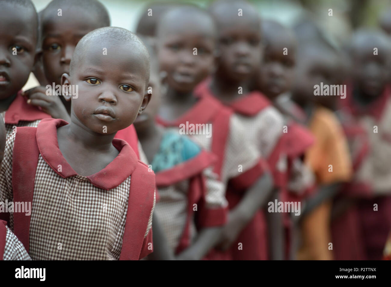 Students line up during an assembly at the beginning of the day in the Loreto Primary School in Rumbek, South Sudan. Stock Photo