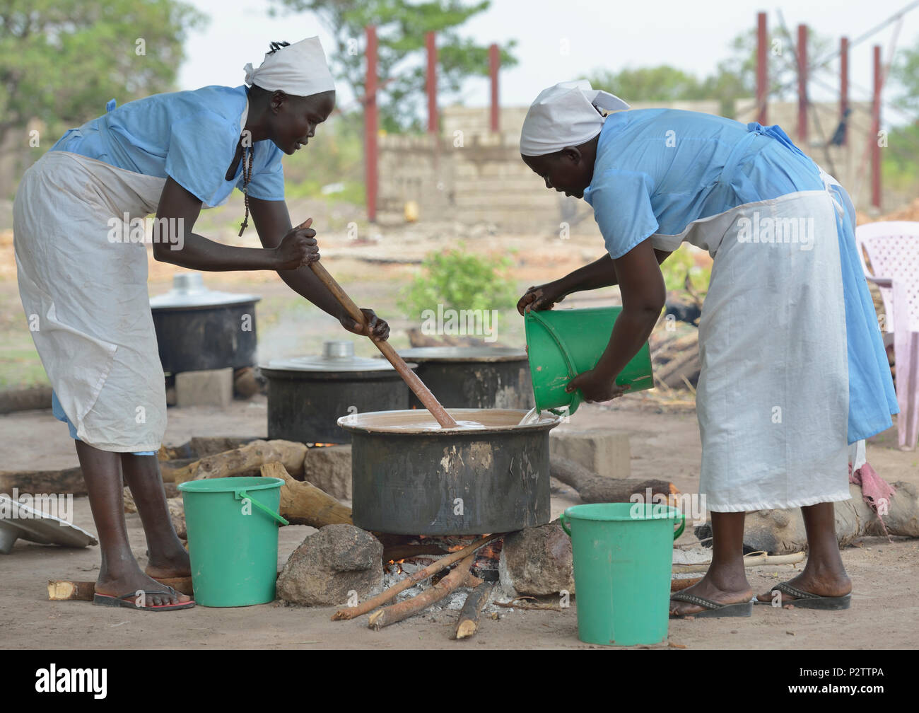 Women prepare food for the Loreto Primary School in Rumbek, South Sudan. Stock Photo