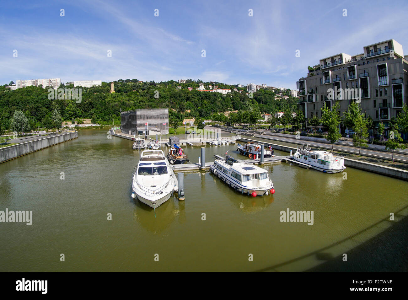 Leasure boats laying at quay in Confluence fluvial harbour, Lyon, France Stock Photo