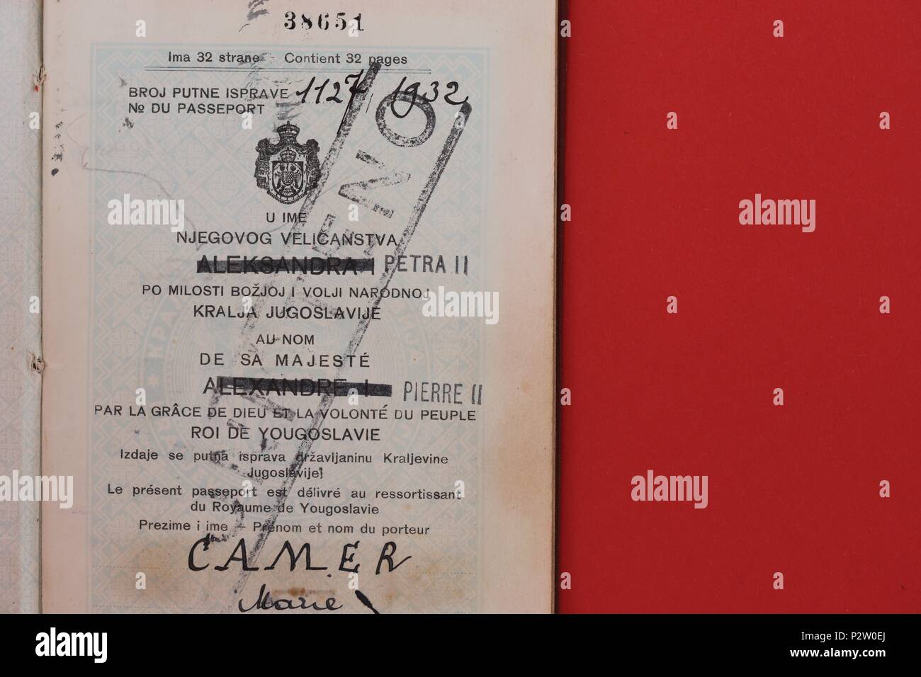 Yugoslavia passport issued in 1932 to female citizen Marie Camer. Stamps show travel to Netherlands and London. Stock Photo