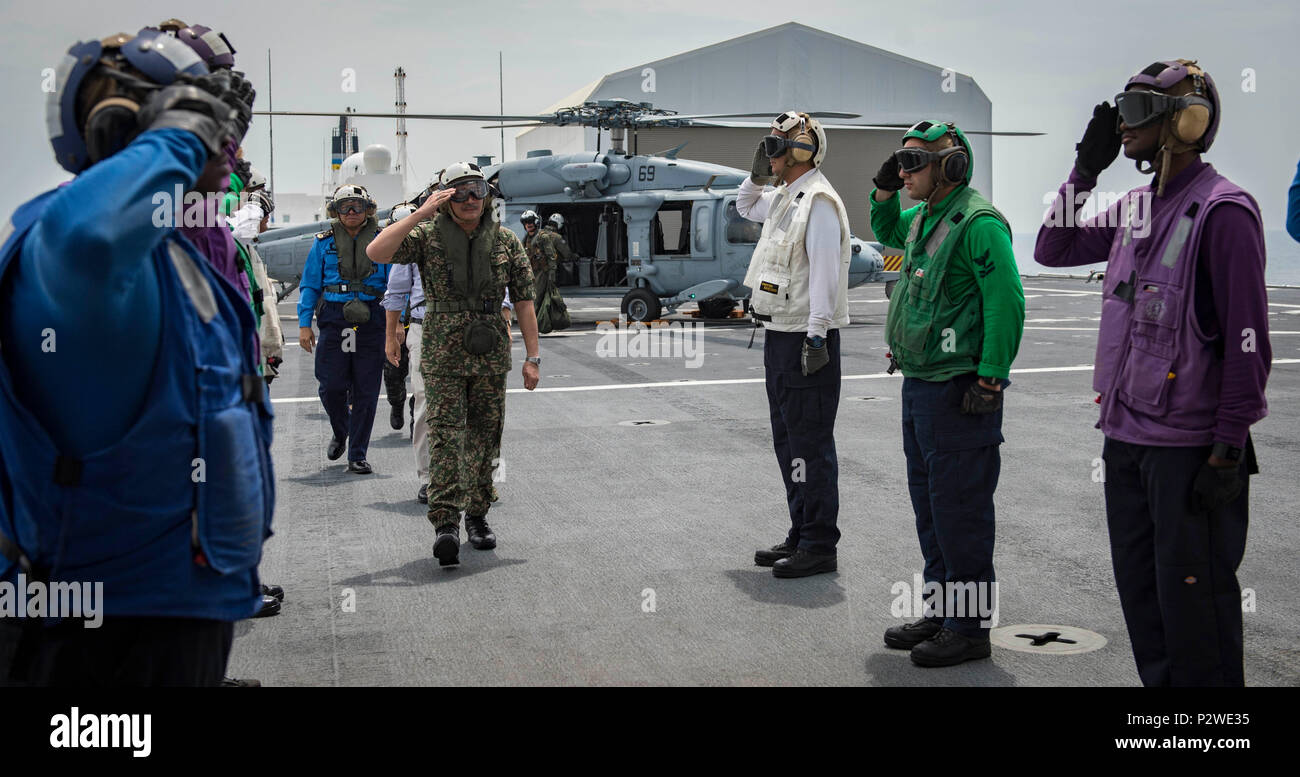 160804-N-QW941-006 KUANTAN, Malaysia (Aug 4, 2016) Dato’ Seri Hishammuddin Tun Hussein, Minister of Defense, Malaysia, salutes sideboys as he arrives aboard hospital ship USNS Mercy (T-AH 19). While aboard Mercy, Hishammuddin met with Pacific Partnership personnel, toured the ship and participated in a press conference. This is the first time Mercy and Pacific Partnership have visited Malaysia. During the mission stop partner nations work side-by-side with local military and civilian organizations in a search and rescue exercise, civil engineering projects, community relation events and subjec Stock Photo