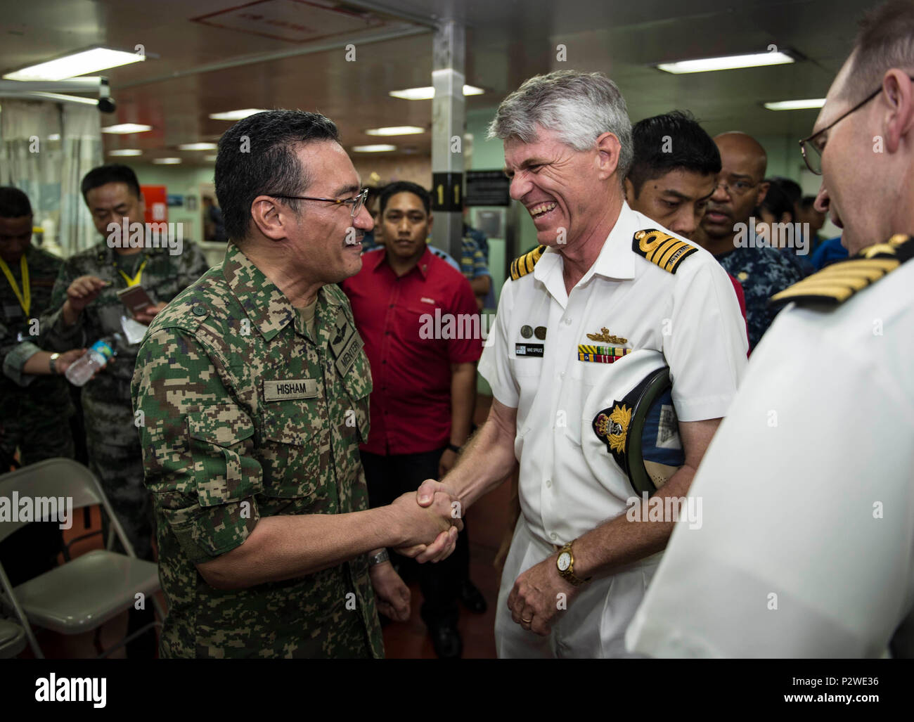 160804-N-QW941-090 KUANTAN, Malaysia (Aug 4, 2016) Royal Australian Navy Reserve Capt. Mike Spruce (right), Pacific Partnership 2016 deputy mission commander, greets Dato’ Seri Hishammuddin Tun Hussein, Minister of Defense, Malaysia, aboard hospital ship USNS Mercy (T-AH 19). While aboard Mercy, Hishammuddin met with Pacific Partnership personnel, toured the ship and participated in a press conference. This is the first time Mercy and Pacific Partnership have visited Malaysia. During the mission stop partner nations work side-by-side with local military and civilian organizations in a search a Stock Photo
