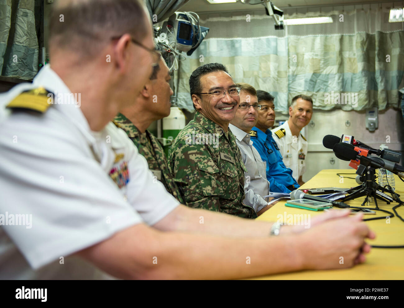 160804-N-QW941-256 KUANTAN, Malaysia (Aug 4, 2016) Dato’ Seri Hishammuddin Tun Hussein (center), Minister of Defense, Malaysia, participates in a press conference held aboard hospital ship USNS Mercy (T-AH 19). While aboard Mercy, Hishammuddin met with Pacific Partnership personnel, toured the ship and participated in a press conference. This is the first time Mercy and Pacific Partnership have visited Malaysia. During the mission stop partner nations work side-by-side with local military and civilian organizations in a search and rescue exercise, civil engineering projects, community relation Stock Photo