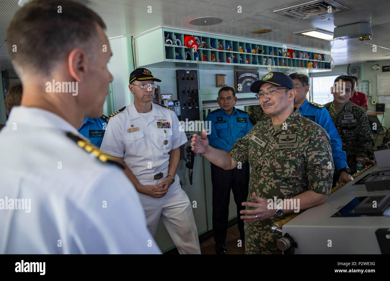160804-N-QW941-414 KUANTAN, Malaysia (Aug 4, 2016) Dato’ Seri Hishammuddin Tun Hussein (right), Minister of Defense, Malaysia, interacts with Capt. Peter Roberts, commanding officer, Medical Treatment Facility, USNS Mercy (T-AH 19) aboard Mercy. While aboard Mercy, Hishammuddin met with Pacific Partnership personnel, toured the ship and participated in a press conference. This is the first time Mercy and Pacific Partnership have visited Malaysia. During the mission stop partner nations work side-by-side with local military and civilian organizations in a search and rescue exercise, civil engin Stock Photo