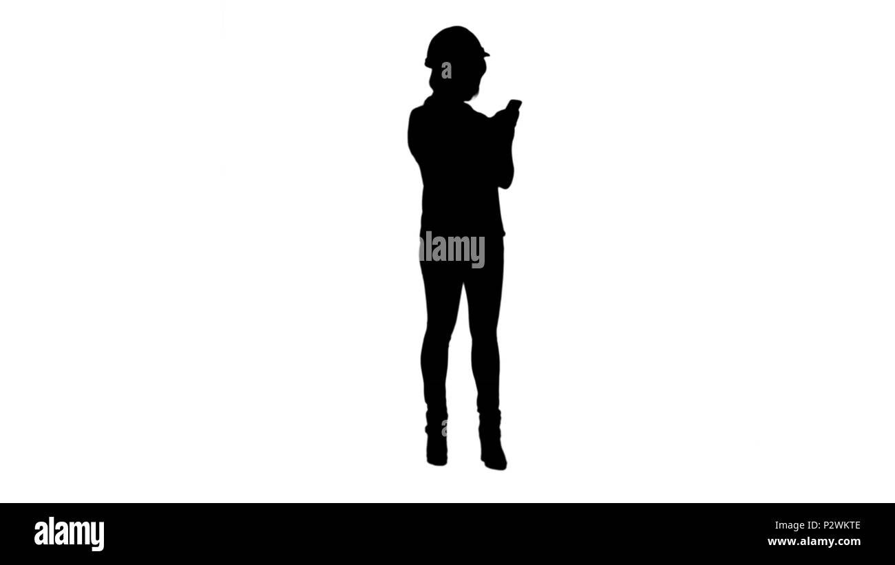 Silhouette Young asian engineer use mobile phone track matte Stock Photo