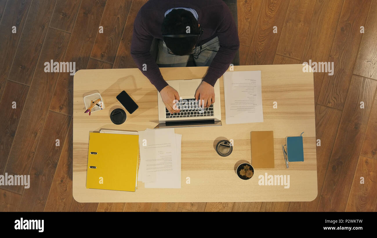 Young man working at a computer in a call centre Stock Photo