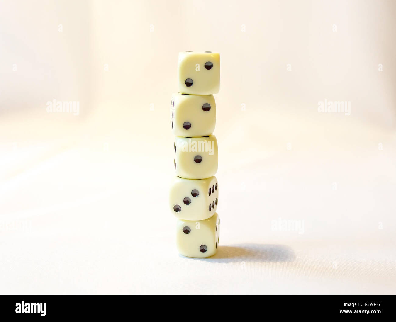 Dice stacked on top of each other random numbers Stock Photo