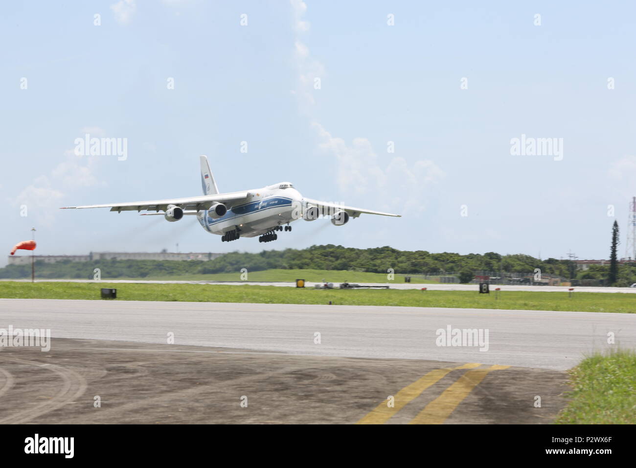 The Antonov-124 aircraft with the Volgar-Dnepr company departs from Marine Corps Air Station Futenma, August 1, 2016. U.S. DoD members with Canadian Aviation Electronics (CAE) work in conjunction with the Volgar-Dnepr crew members to load gear for transport to Marine Corps Air Station Iwikiuni, Japan. (U.S. Marine Corps photo by Lance Cpl. Brooke Deiters/ Released) Stock Photo