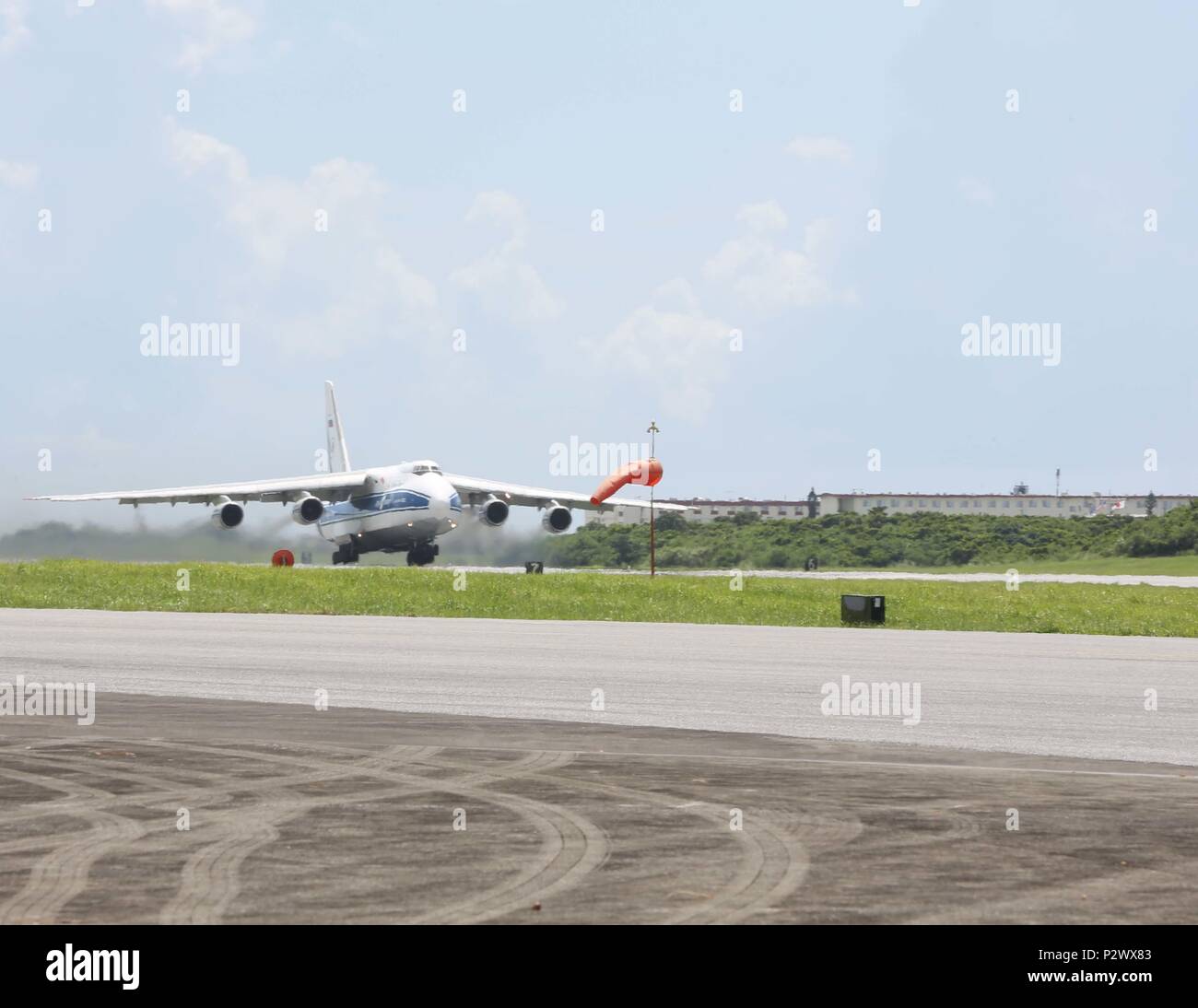 The Antonov-124 aircraft with the Volgar-Dnepr company departs from Marine Corps Air Station Futenma, August 1, 2016. U.S. DoD members with Canadian Aviation Electronics (CAE) work in conjunction with the Volgar-Dnepr crew members to load gear for transport to Marine Corps Air Station Iwikiuni, Japan. (U.S. Marine Corps photo by Lance Cpl. Brooke Deiters/ Released) Stock Photo