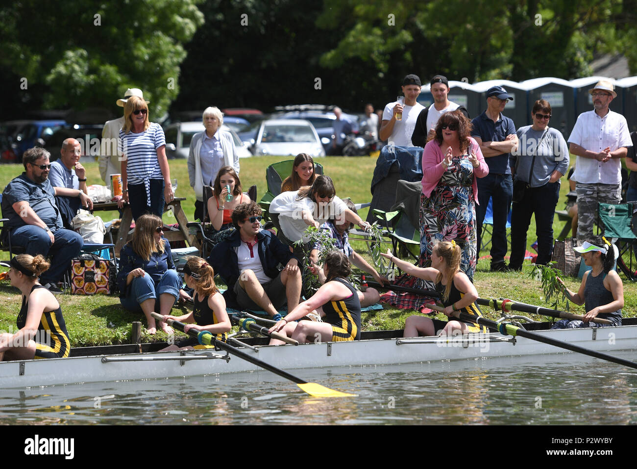 Clare College Are Handed Greenery From The River Bank After Winning Their Blades A Term Meaning They Have Bumped Four Or More Times During The Final Day Of The Cambridge University May