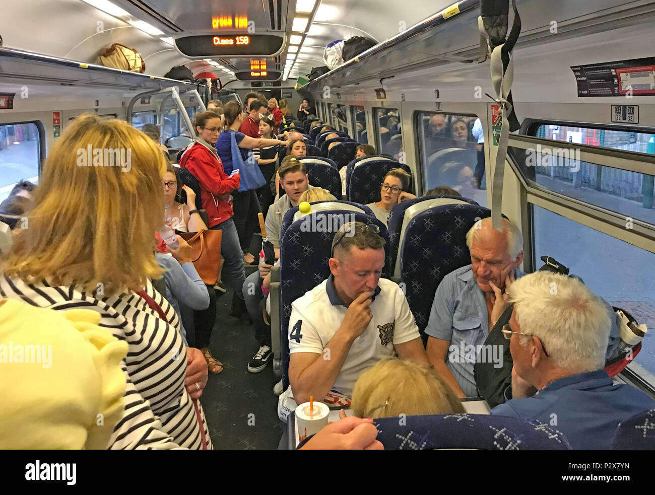 Busy, Overcrowded Scotrail Class 158 train on borders railway Edinburgh to Tweedbank Stock Photo
