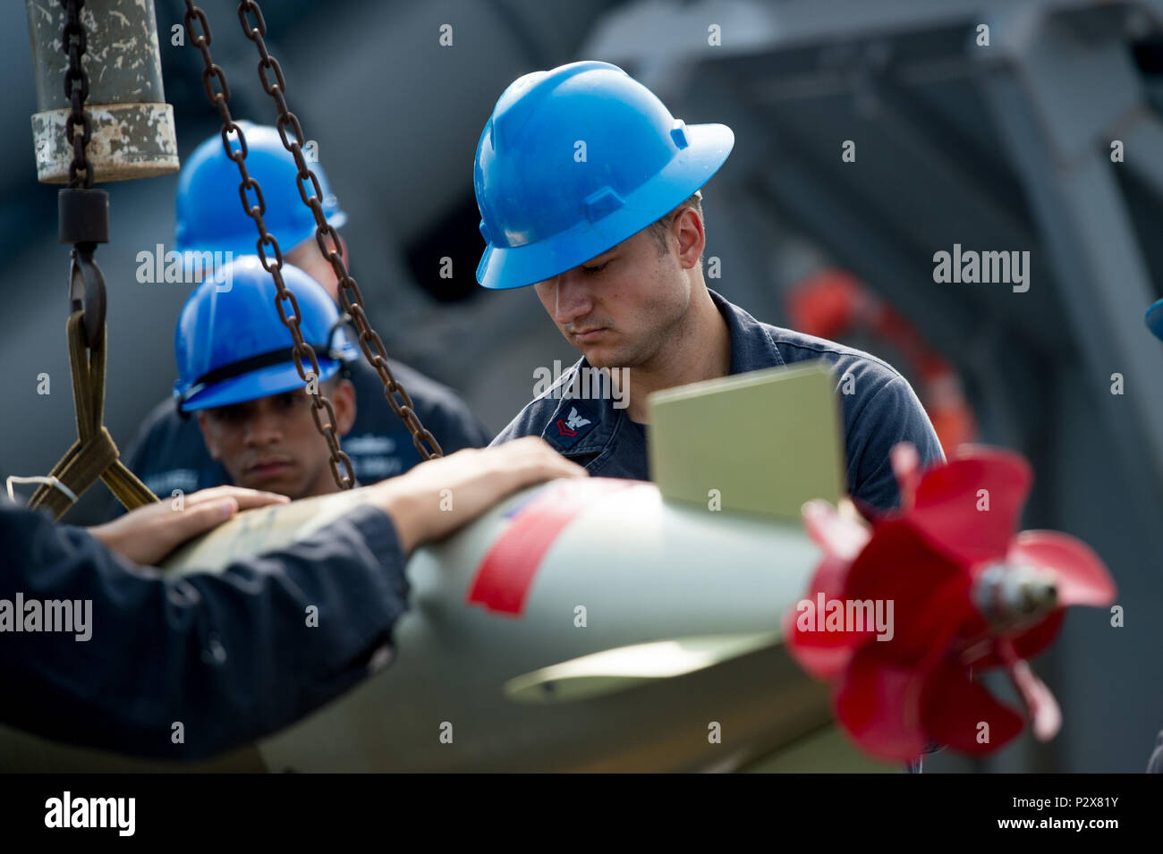 On the aft missile deck of guided‑missile destroyer USS Barry, a sonar ...