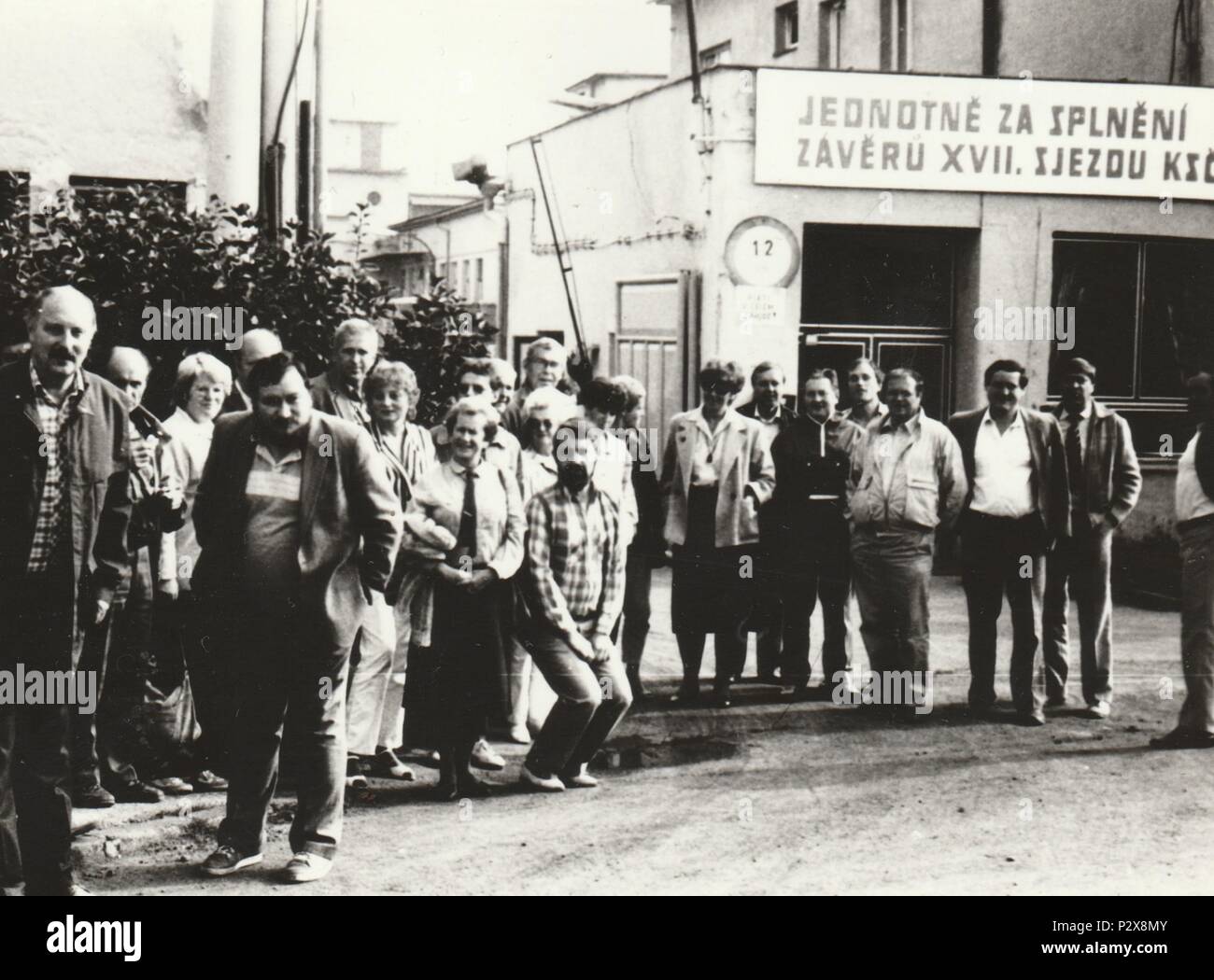 THE CZECHOSLOVAK SOCIALIST REPUBLIC - CIRCA 1970s: Vintage photo shows workers in front of factory. Photography from communist era. Retro black & white  photography Stock Photo