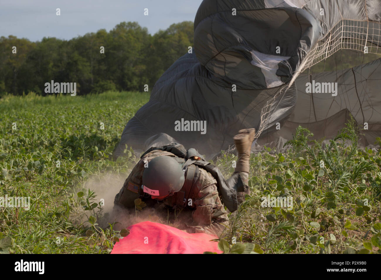 U.S. Army Paratrooper Warrent Officer Greg Suchanek, Special Operations Detachment (NATO) dives onto a target during Leapfest 2016 in West Kingston, R.I., August 4, 2016. Leapfest is an International parachute training event and competition hosted by the 56th Troop Command, Rhode Island Army National Guard to promote high level technical training and esprit de corps within the International Airborne community. (U.S. Army photo by Sgt. Brady Pritchett / Released) Stock Photo