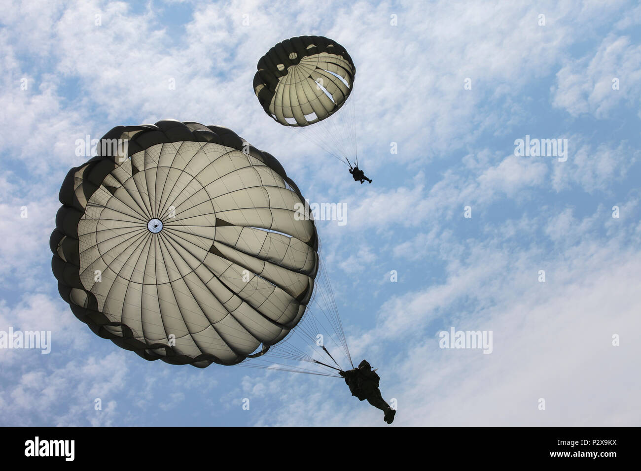Two German Paratroopers parachutes to the Drop Zone during Leapfest 2016 at  the University of Rhode Island, West Kingston, R.I., August 6, 2016.  Leapfest is the largest, longest standing, international static line