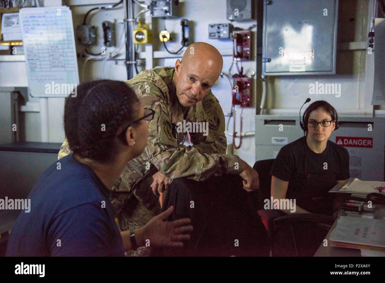 160805-N-TV337-202  ARABIAN GULF (Aug. 5, 2016) – Maj. Gen. Darsie Rogers, commanding general, Special Operations Command Central, middle, listens to a Sailor explain her watch station in the Tactical Flag Command Center (TFCC) aboard the aircraft carrier USS Dwight D. Eisenhower (CVN 69) (Ike). Ike and its Carrier Strike Group are deployed in support of Operation Inherent Resolve, maritime security operations and theater security cooperation efforts in the U.S. 5th Fleet area of operations. (U.S. Navy photo by Mass Communication Specialist 3rd Class Bobby Baldock/Released) Stock Photo