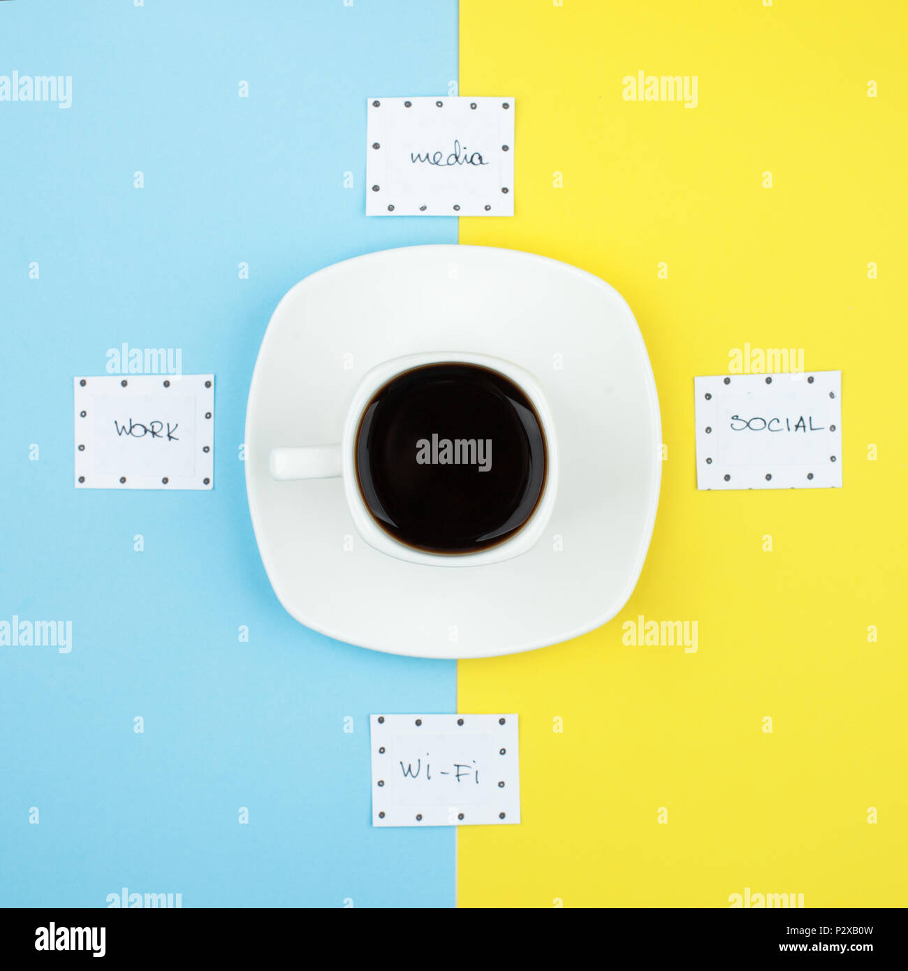 Coffee time, unplugged, coffee break concept. Cup of coffee espresso and words wi-fi, media, work, social on duo tone bright background, flat lay, top Stock Photo