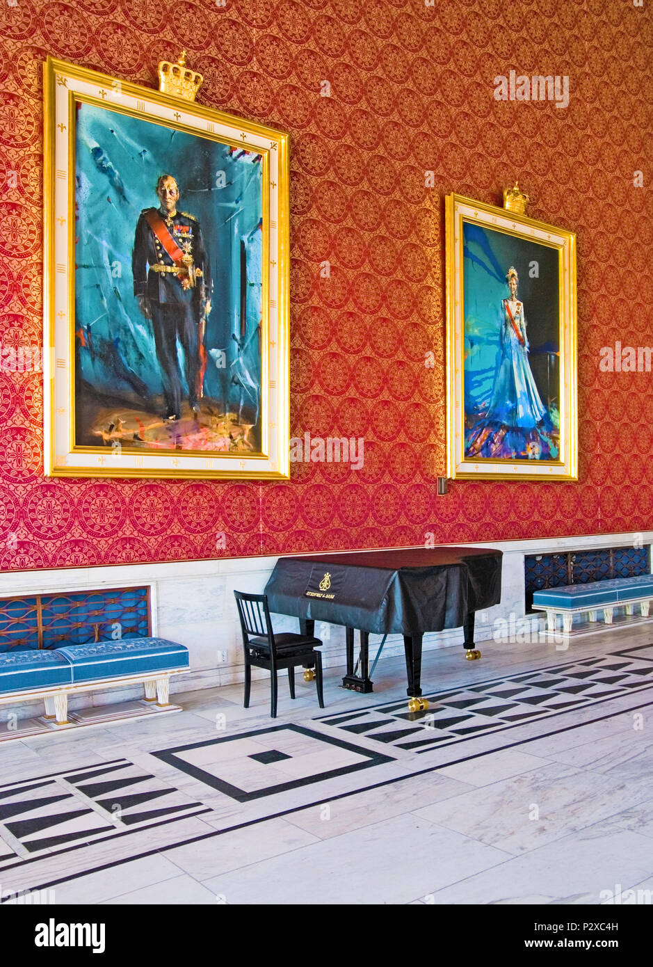 OSLO, NORWAY - APRIL 12, 2010: The banquet hall in City Hall of Oslo. The portraits of King of Norway Harald V and Queen of Norway Sonja Stock Photo