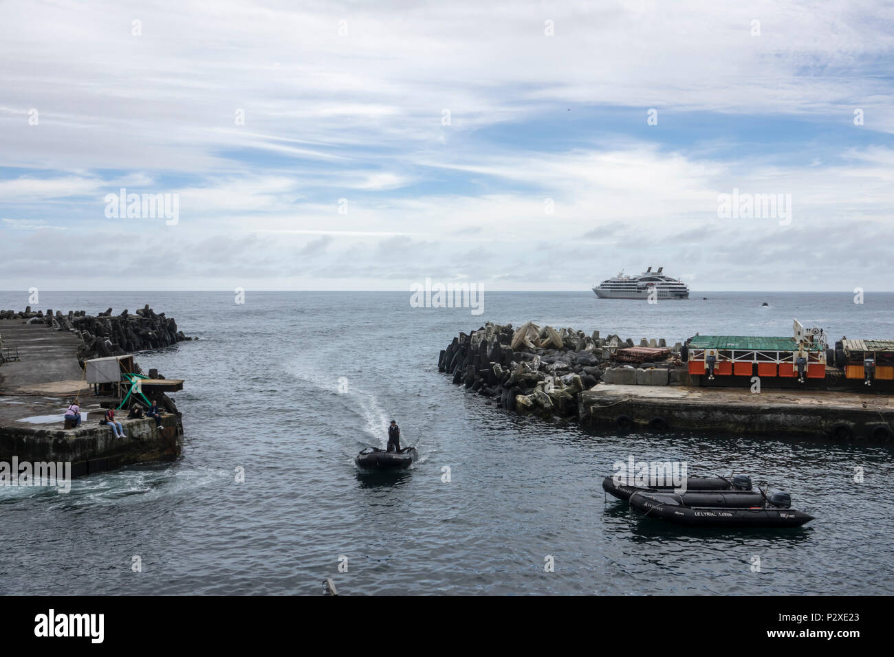 Zodiac arriving to collect passengers at Tristan da Cunha, British Overseas Territories, South Atlantic Ocean Stock Photo
