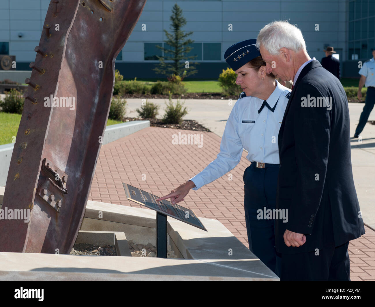 U.S. Air Force Gen. Lori Robinson, Commander of North American Aerospace Defense Command and United States Northern Command, introduces the Honourable Stephane Dion, Canadian Minister of Foreign Affairs, to the NORAD and USNORTHCOM 9/11 Memorial outside the command’s headquarters in Colorado Springs, Colo., Aug 8, 2016. During his visit, Minister Dion was briefed on both NORAD and USNORTHCOM missions and the unique partnership that the U.S. and Canada share. (Photo by: N-NC Public Affairs/Released) Stock Photo