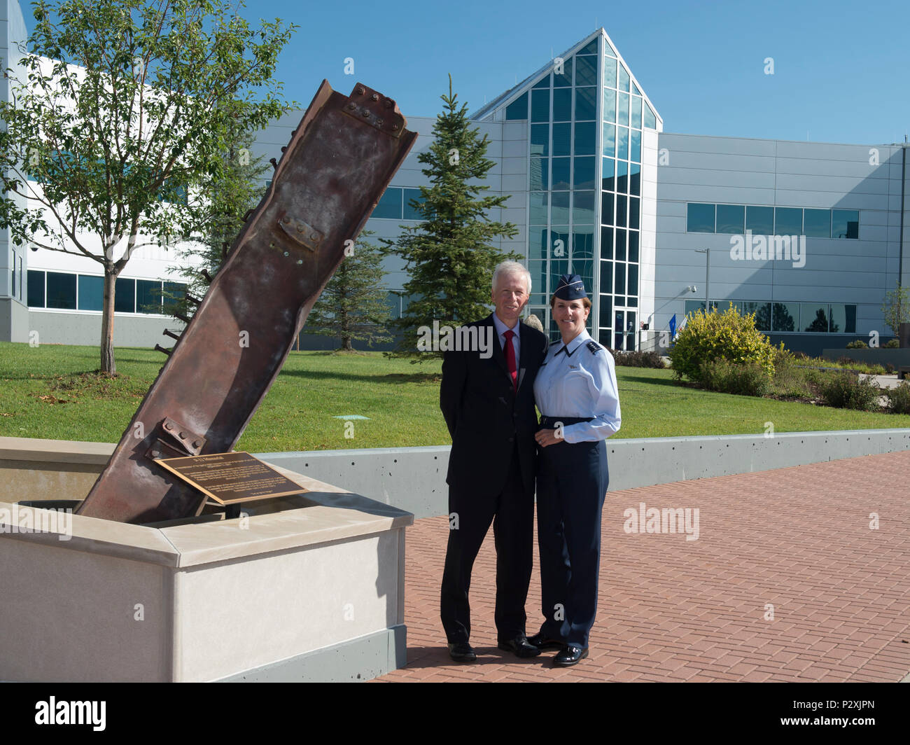 U.S. Air Force Gen. Lori Robinson, Commander of North American Aerospace Defense Command and United States Northern Command, poses with the Honourable Stephane Dion, Canadian Minister of Foreign Affairs, to the NORAD and USNORTHCOM at the 9/11 Memorial outside the command’s headquarters in Colorado Springs, Colo., Aug 8, 2016. During his visit, Minister Dion was briefed on both NORAD and USNORTHCOM missions and the unique partnership that the U.S. and Canada share. (Photo by: N-NC Public Affairs/Released) Stock Photo