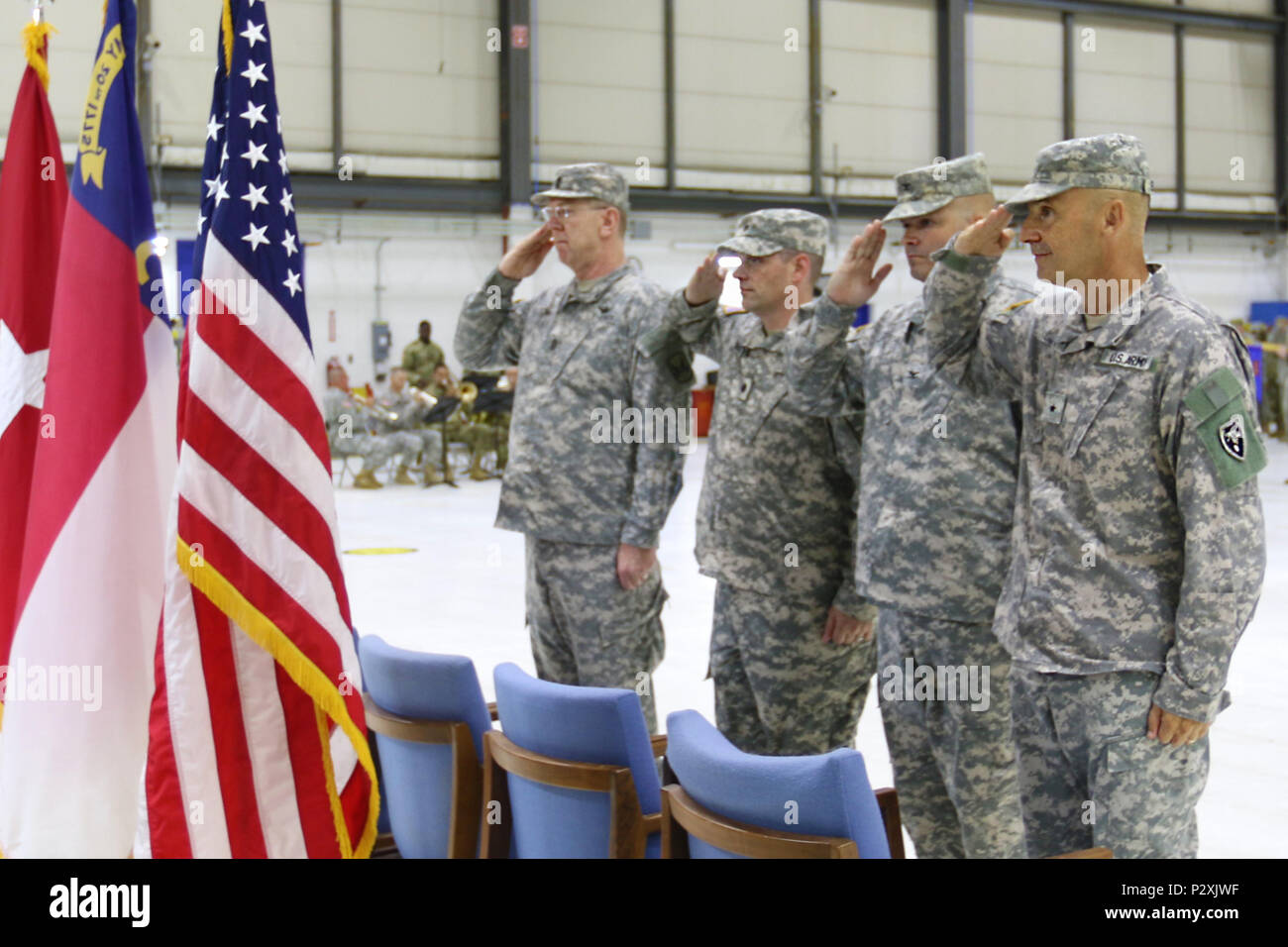 Brig. Gen. James C. Ernst, Lt. Col. Joseph W. Bishop, Col. Jeffrey L. Copeland and Command Sgt. Maj. Derwood L. Norris salute during the change of command ceremony at the North Carolina Army National Guard's Army Aviation Support Facility 1 in Morrisville, N.C., on August 7, 2016. Bishop, who served for the last 18 years in the United States Army and Army National Guard and previously commanded the 1-130th Attack Reconnaissance Battalion, became newly minted commander of 449th Theater Aviation Brigade. (U.S. Army National Guard photo by Sgt. Lisa Vines, 449th Theater Aviation Brigade) Stock Photo