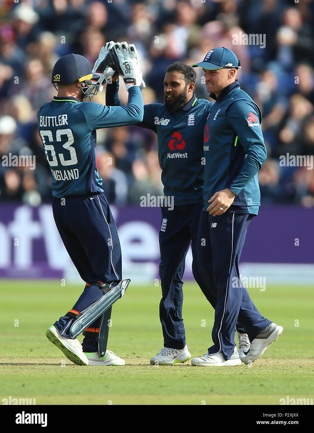 England's Adil Rashid (centre) celebrates with Jos Buttler (left) and ...