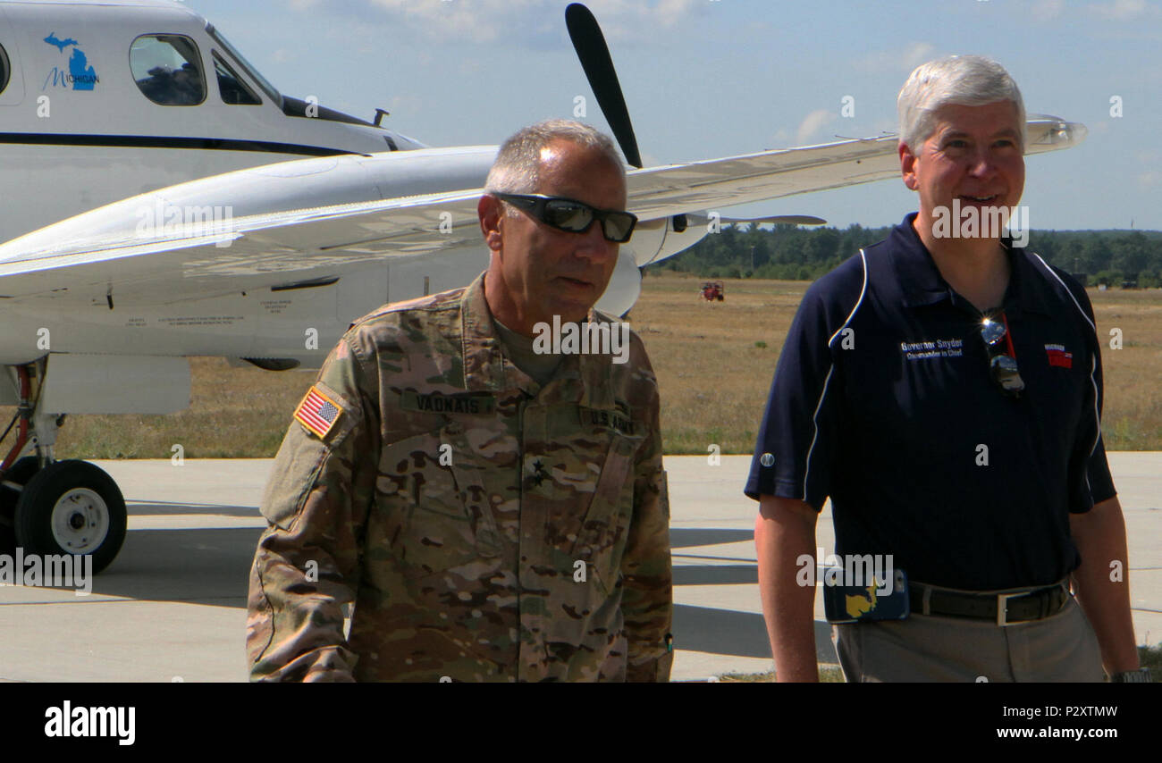 Major General Gregory Vadnais, The Adjutant General for the state of Michigan, and Governor Rick Snyder arrive at Camp Grayling Airfield to observe the large-scale, multi-agency Exercise Northern Strike taking place from Aug. 1st until Aug. 20th at Camp Grayling Joint Maneuver Training Center. (Michigan National Guard photo by Spc. Alan Prince /Released) Stock Photo