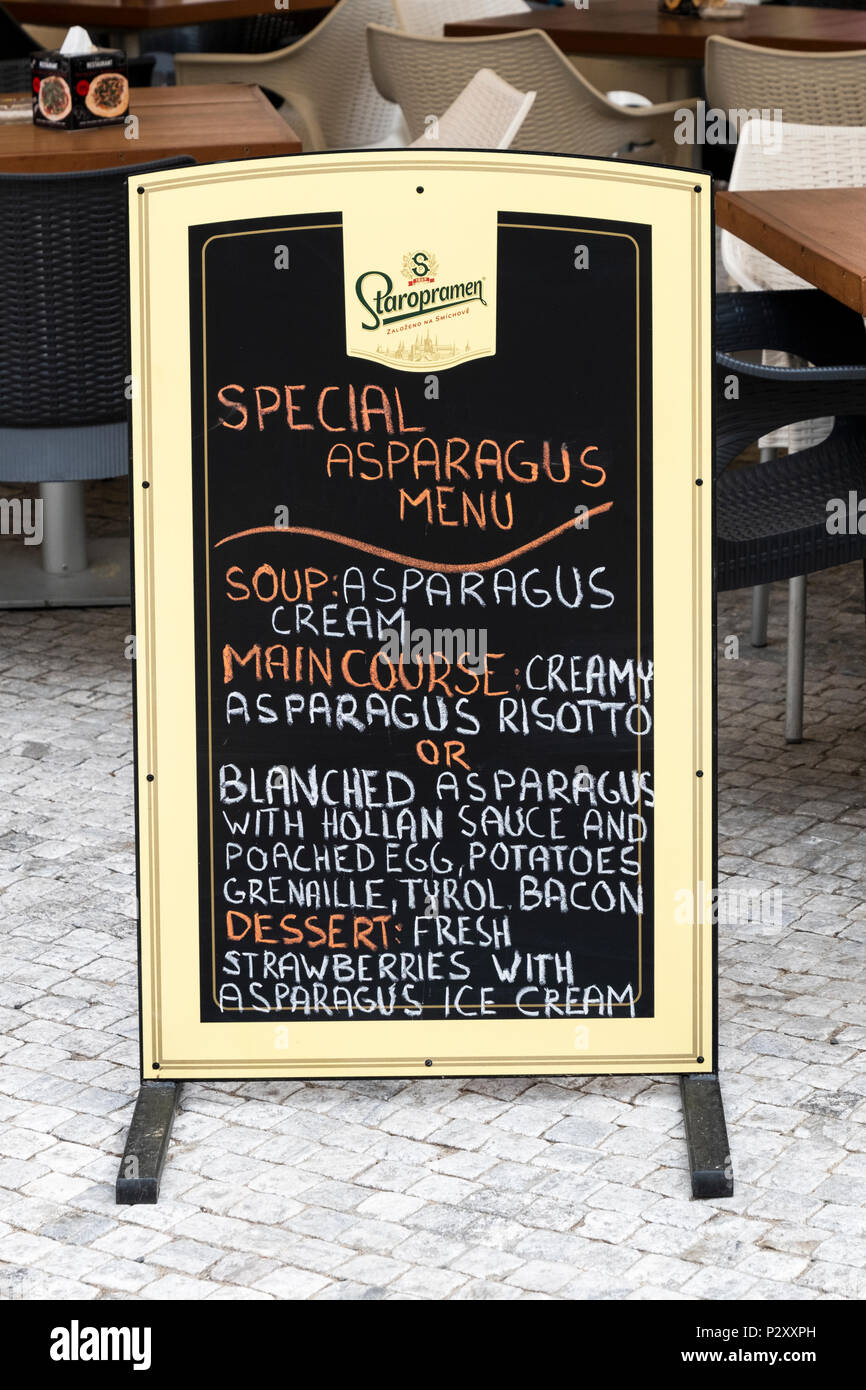 A sign outside cafe NG Kinsky in Old Town Square in Prague promoting asparagus food dishes during the time they are in season. Stock Photo