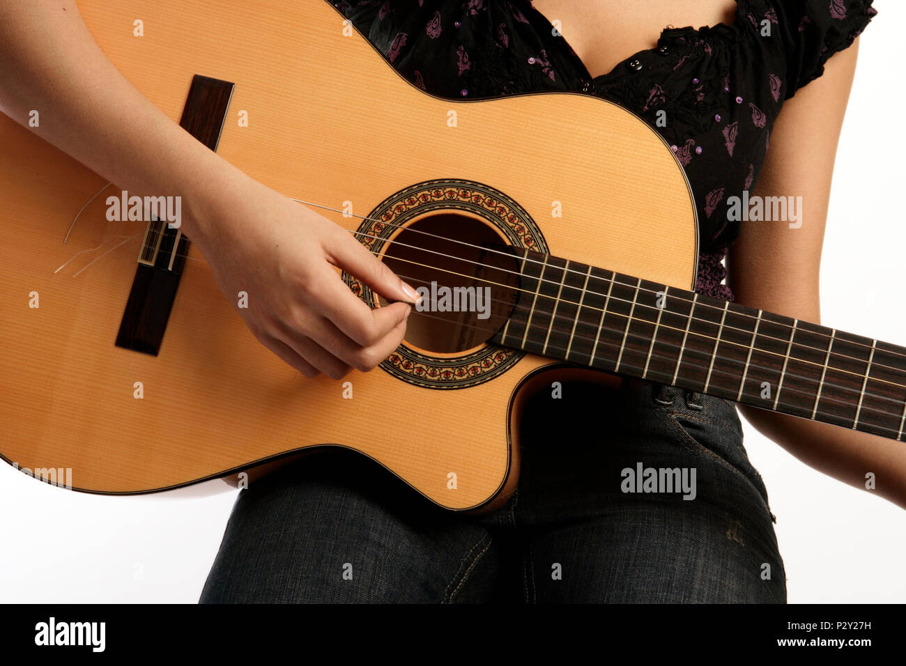 Young woman playing the acoustic guitar Stock Photo - Alamy