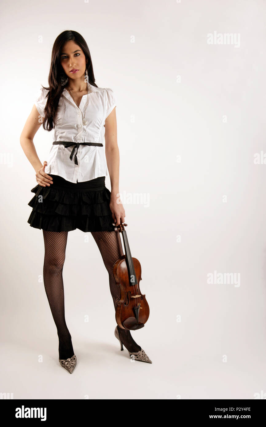 Generic - young teenage asain girl holding a violin Stock Photo