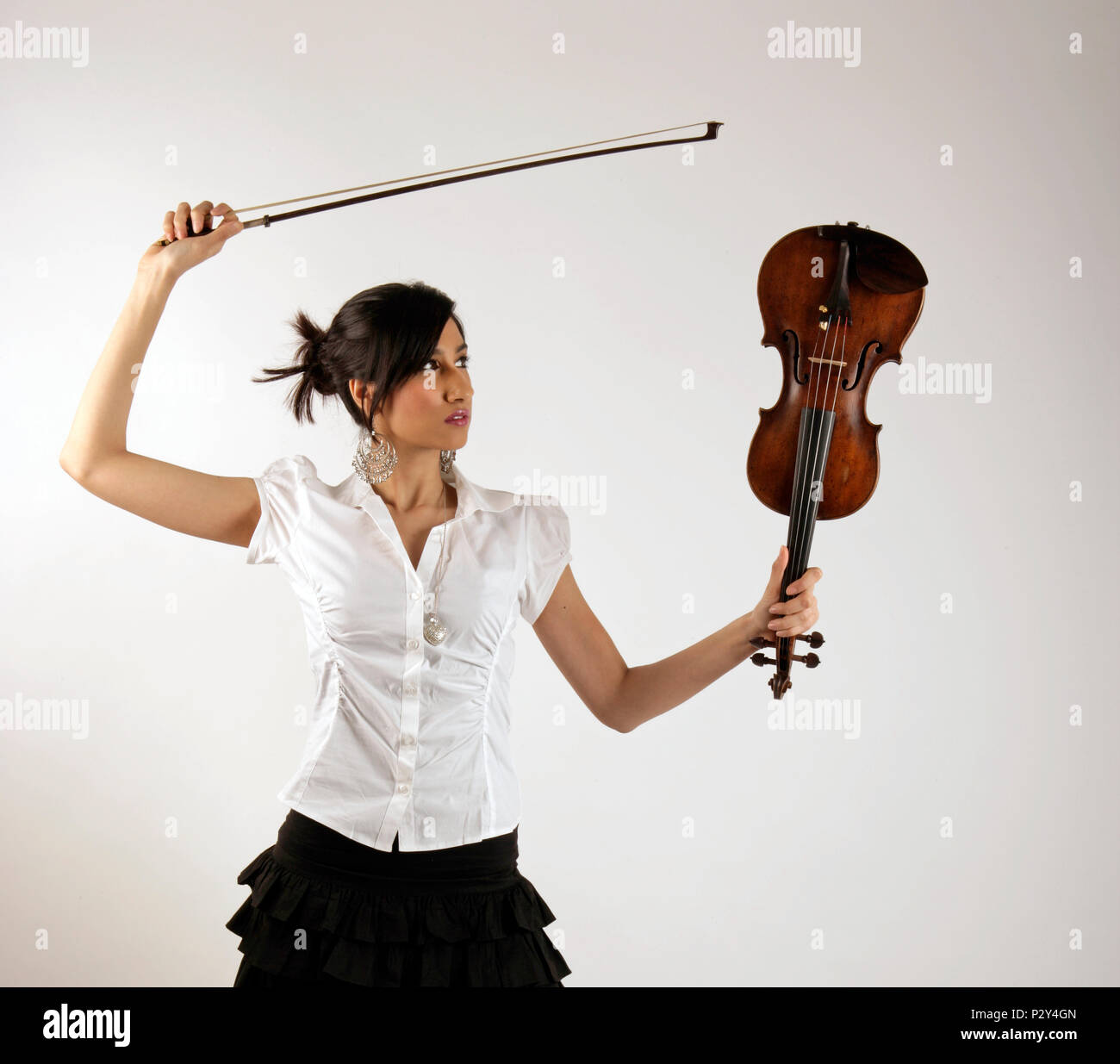 Generic - Young Asian girl holding a violin and bow Stock Photo