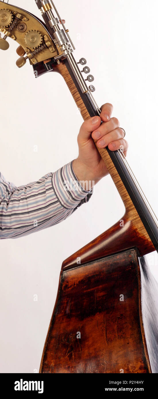 double bass neck being held by a player. Stock Photo