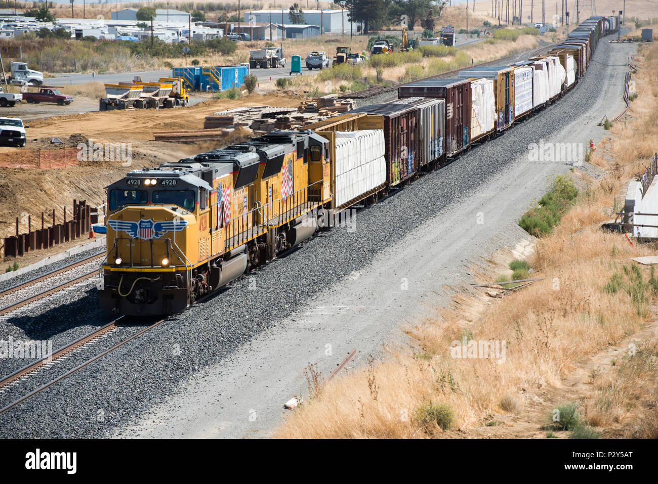 A freight train approached the ongoing construction site of the new