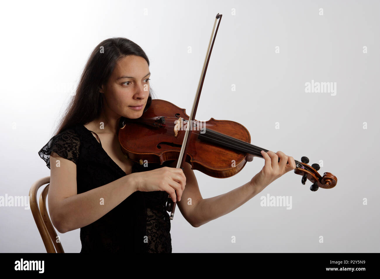 Generic - Viola player playing with the bow Stock Photo - Alamy