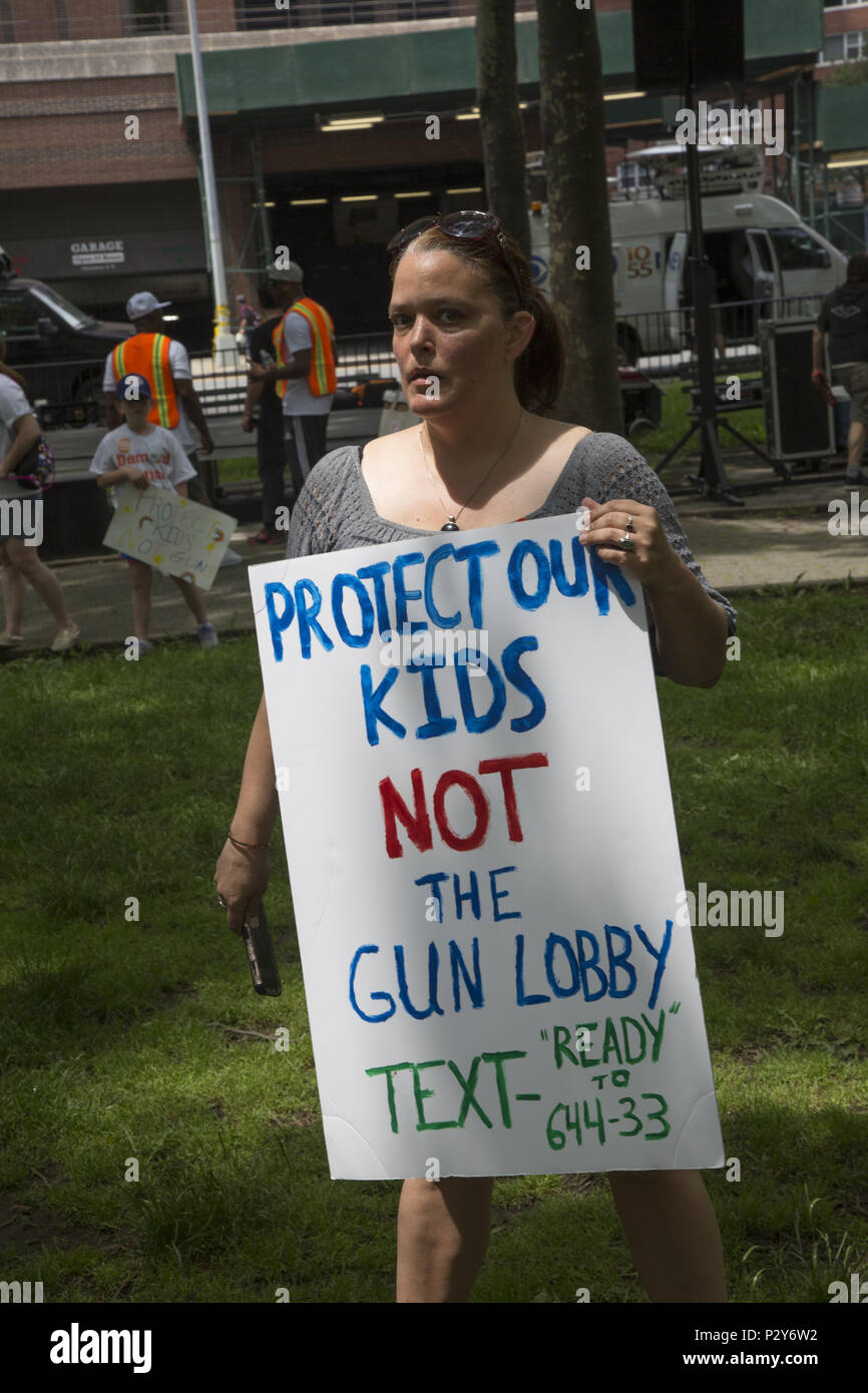The annual 'Moms Demand Action' Gun Sense In America March over the Brooklyn Bridge in 2018 was joined by 'Youth Over Guns' organization working to stop gun violence in communities of color where kids are killed on an almost daily basis around the USA. Stock Photo