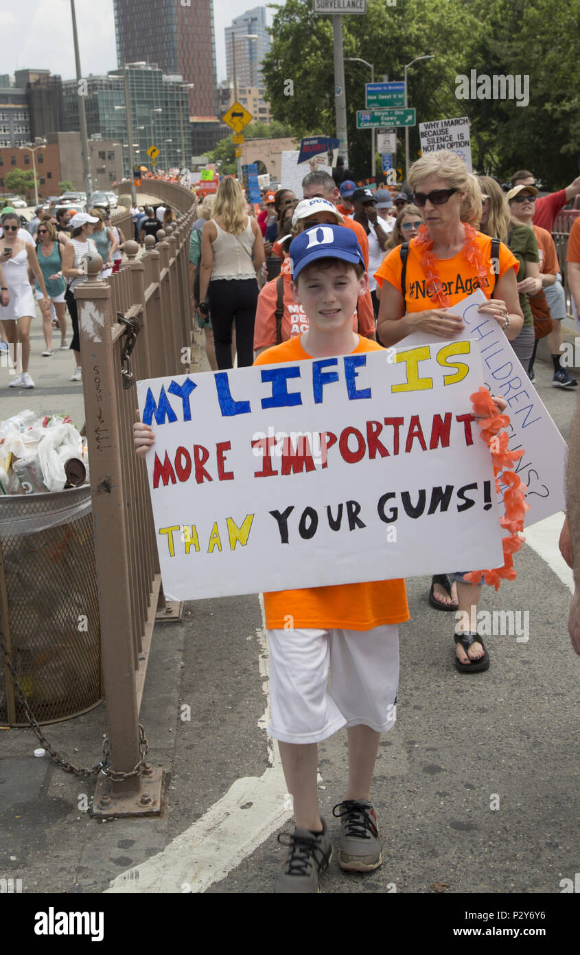 The annual 'Moms Demand Action' Gun Sense In America March over the Brooklyn Bridge in 2018 was joined by 'Youth Over Guns' organization working to stop gun violence in communities of color where kids are killed on an almost daily basis around the USA. Stock Photo