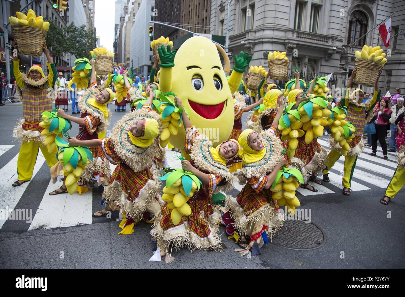 Energetic Filipino Dance troupe promote Philippine Mango Festivals. Philippine Independence Day Parade on Madison Avenue in New York City, Stock Photo