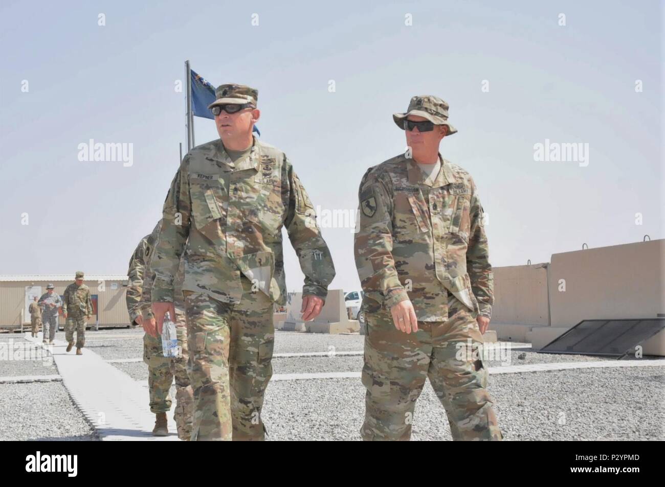 Command Sgt. Maj. Christopher S. Kepner, left, the 11th sergeant major of the Army National Guard, receives a guided tour of the 17th Sustainment Brigade’s area of operations on Camp Arifjan, Kuwait from Command Sgt. Maj. James Richardson, the senior enlisted advisor of the 17th SB, 1st Sustainment Command (Theater) August 10, 2016. Kepner’s tour was part of a multi-day visit to National Guard Soldiers in Southwest Asia. (U.S. Army National Guard photo by Sgt. Walter H. Lowell) Stock Photo