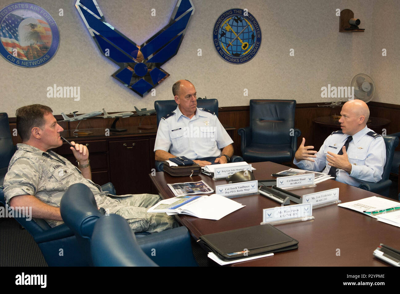 brig-gen-john-s-shapland-center-director-of-air-space-and-cyberspace-operations-for-air-force-materiel-command-listens-as-col-roman-l-hund-right-66th-air-base-group-commander-provides-an