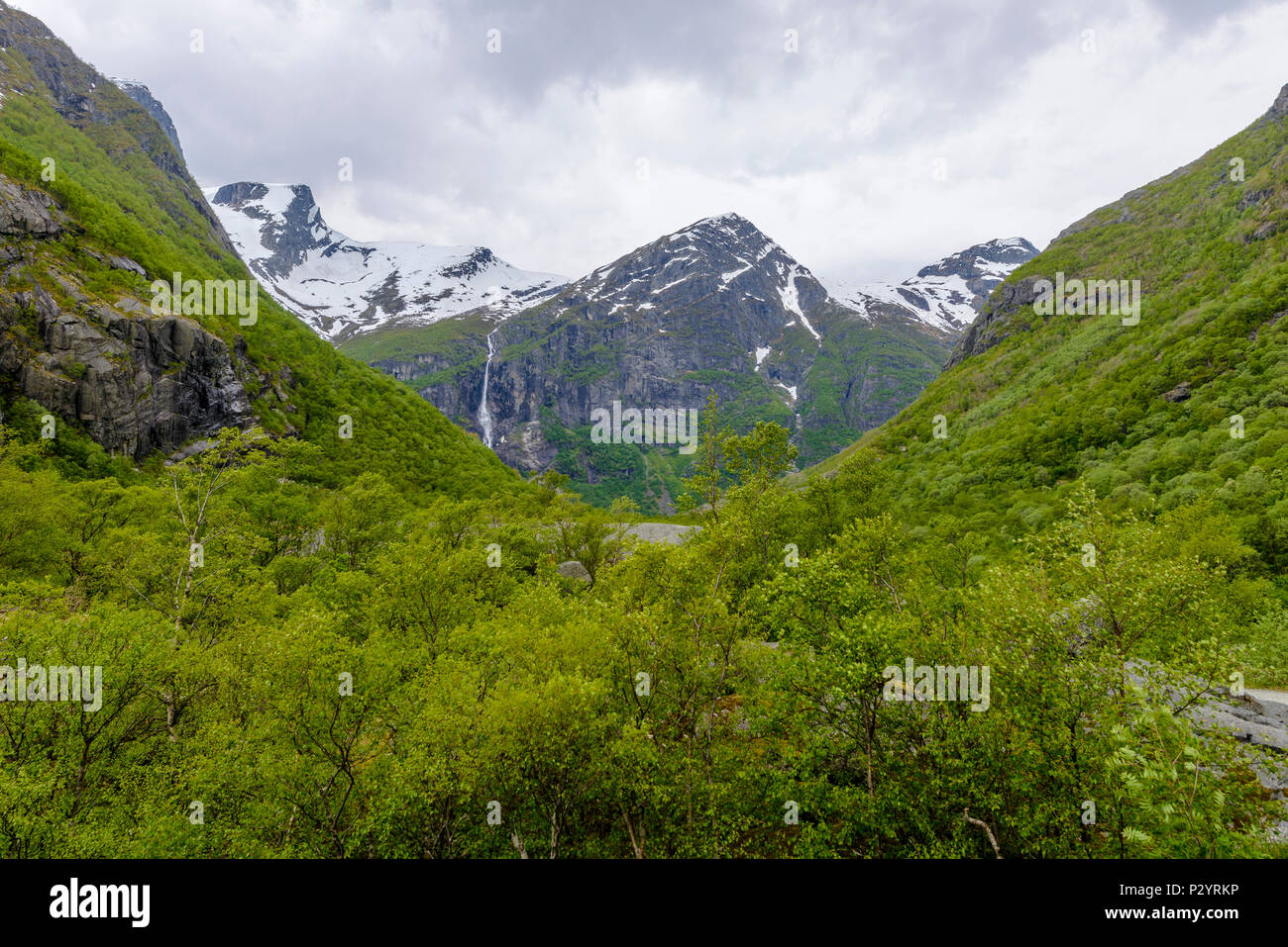 Green Mountains with Glacier Briksdal, a view from the back Stock Photo