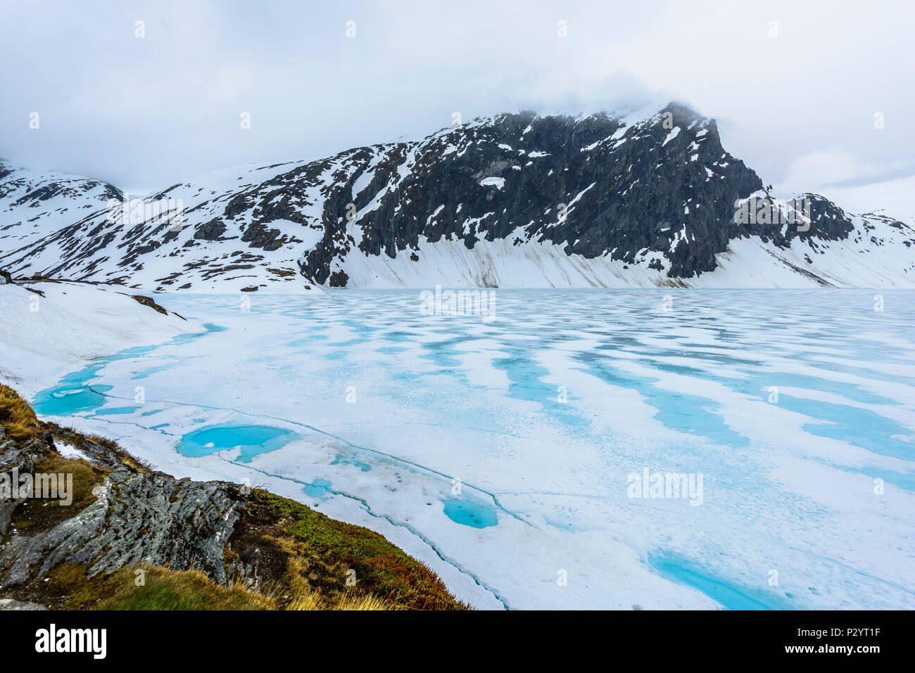 Frozen mountain lake with ice -lake Stavatn in Telemark, Norway Stock Photo