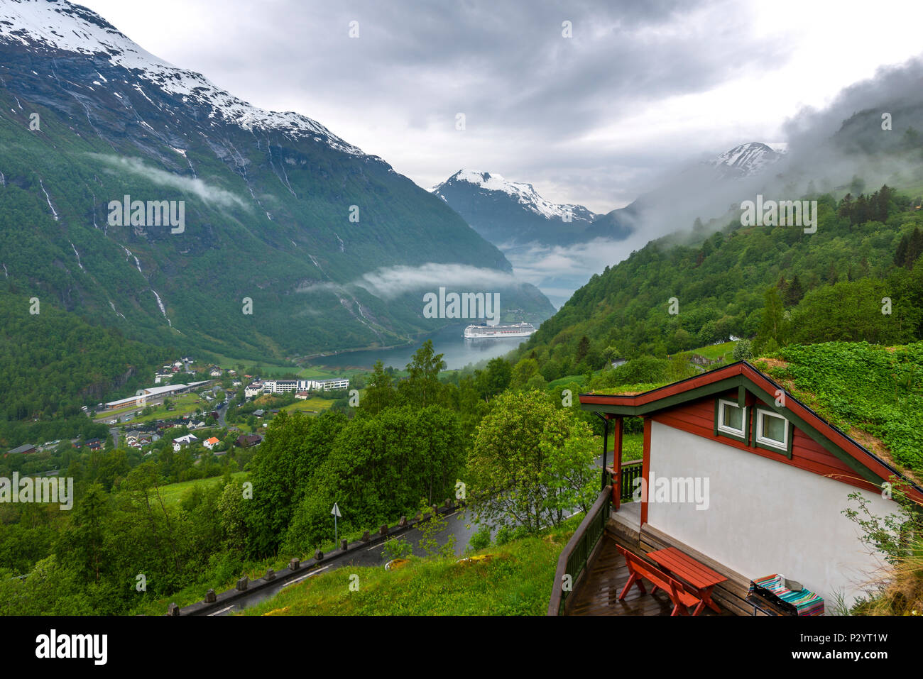End of the famous Geiranger fjord, Norway with cruise ship- view from cottage Stock Photo