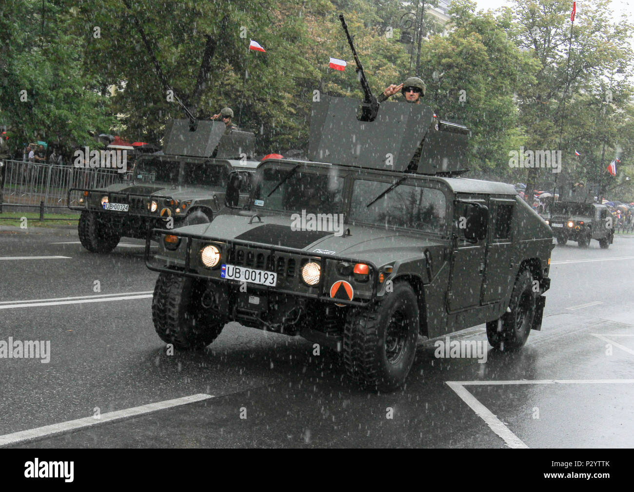 WARSAW, Poland – Polish soldiers salute from Humvees during the Armed Forces Day Parade in Warsaw, Poland, Aug. 15, 2016. The parade, held annually in the capital, commemorates the 96th anniversary of the Polish victory over Soviet Russia at the Battle of Warsaw in 1920 during the Polish-Soviet War. The event included participation from over one thousand Polish soldiers and soldiers from several allied countries including U.S. Soldiers of Company D, 3rd Combined Arms Battalion, 69th Armor Regiment, 3rd Infantry Division. (U.S. Army photo by Sgt. Lauren Harrah/Released) Stock Photo