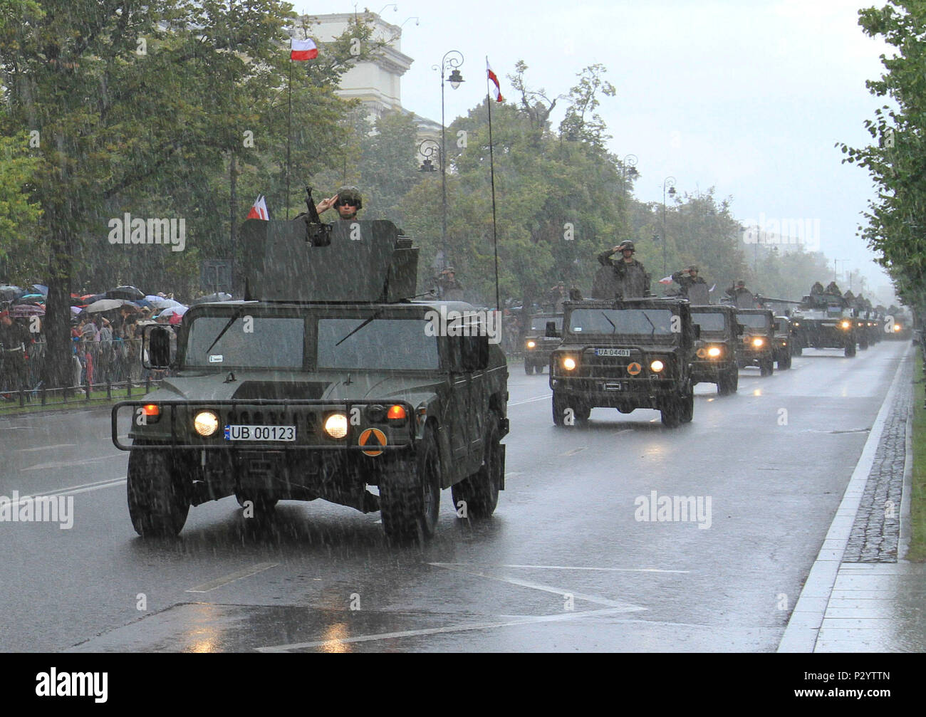 WARSAW, Poland – Polish soldiers salute from military vehicles during the Armed Forces Day Parade in Warsaw, Poland, Aug. 15, 2016. The parade, held annually in the capital, commemorates the 96th anniversary of the Polish victory over Soviet Russia at the Battle of Warsaw in 1920 during the Polish-Soviet War. The event included participation from over one thousand Polish soldiers and soldiers from several allied countries including U.S. Soldiers of Company D, 3rd Combined Arms Battalion, 69th Armor Regiment, 3rd Infantry Division. (U.S. Army photo by Sgt. Lauren Harrah/Released) Stock Photo
