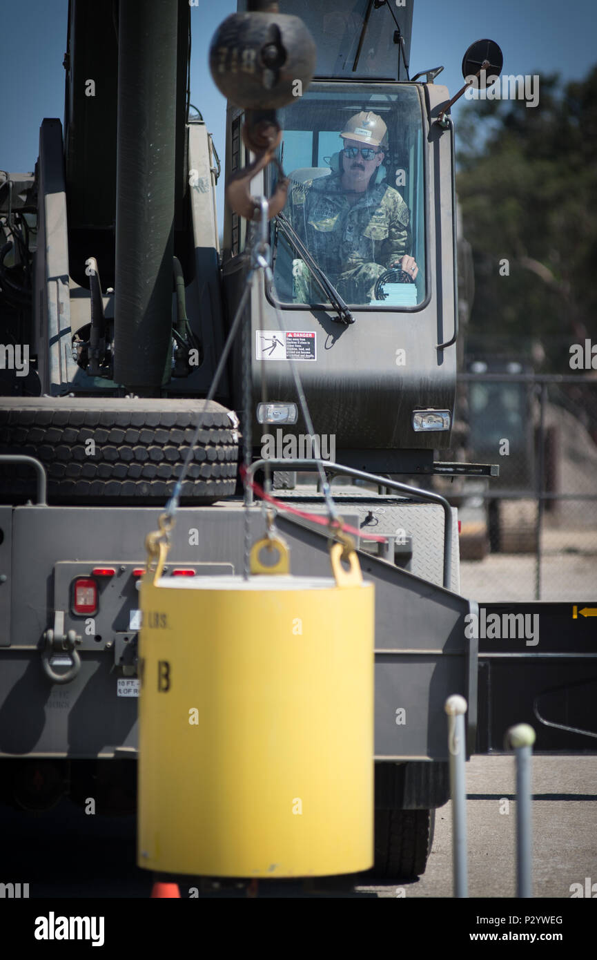 160811-N-HN991-405 NAVAL BASE VENTURA COUNTY, Calif. (Aug. 11, 2016) – Equipment Operator 2nd Class Allan Loutzenhiser, a student at Naval Construction Training Center (NCTC), performs a hook block test during crane operation training. NCTC develops and trains Sailors, Soldiers, Airman, and Marines in construction trades and military skills for the Department of Defense. (U.S. Navy photo by Mass Communication Specialist 2nd Class David Hooper/Released) Stock Photo